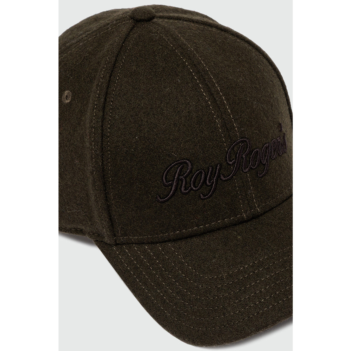 Cappello con visiera in lana verde