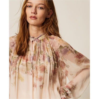 Blusa fantasia a fiori in creponne