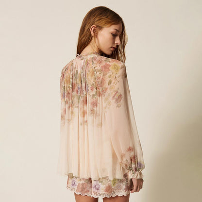 Blusa fantasia a fiori in creponne